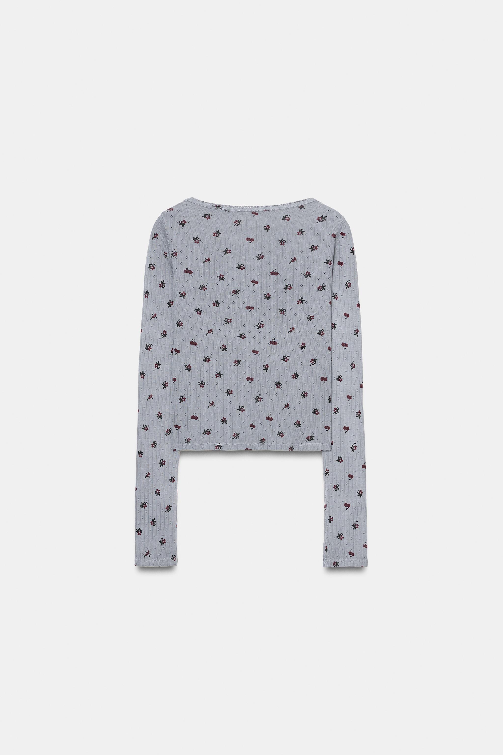 VESTE POINTELLE À FLEURS